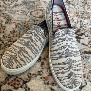 Cream and navy printed Rothy’s “The Sneaker” style